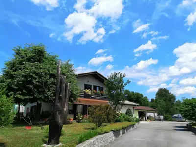 a house with a balcony on the side of a road at Deno in Podgrad
