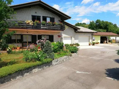 a house with flower boxes on the side of it at Deno in Podgrad