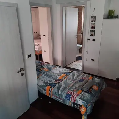 a small bedroom with a bed in a room at Apartma Rok in Plavje