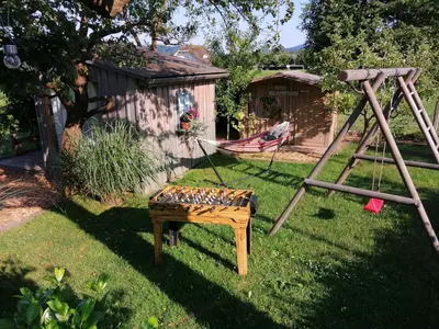 a hammock and a swing in a yard at Glamping with a view in Smlednik