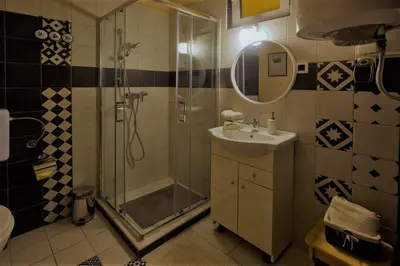 a bathroom with a shower and a sink at Apartma Caprivi Zavod za razvoj turizma Kočevski rog in Kočevje