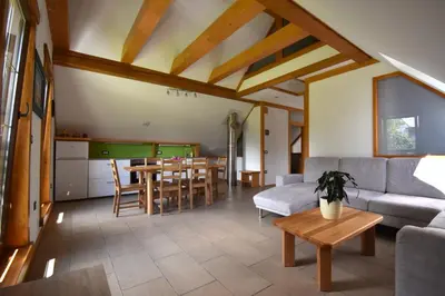 a living room with a couch and a table at Apartma Tima in Bovec