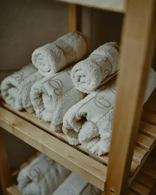 a bunch of towels are on a shelf at Schneider Living in Bovec