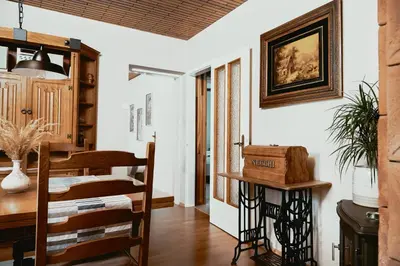 a kitchen and dining room with a table and chairs at Schneider Living in Bovec