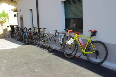 a row of bikes parked next to a building at Apartmaji Tanto Malovše in Črniče