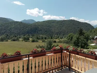a balcony with a view of a mountain at APARTMENT WITH A VIEW in Bohinjska Bistrica