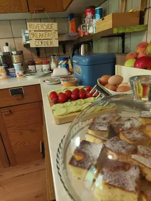 a kitchen counter with a plate of food on it at The RiverSide Chill Hostel in Bled