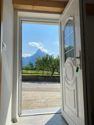 an open door with a view of a mountain at Apartma Stres in Bovec