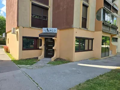 a building with a akc sign in front of it at Delux apartment ARSO in Velenje