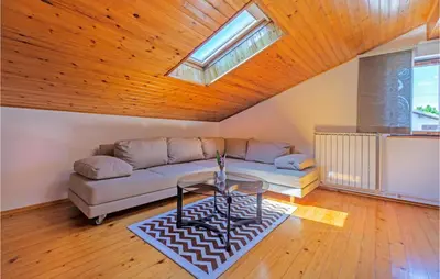 a living room with a couch and a table at Stunning Apartment In Divaca With Wifi in Divača