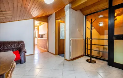 a living room with a couch and a table at Stunning Apartment In Divaca With Wifi in Divača