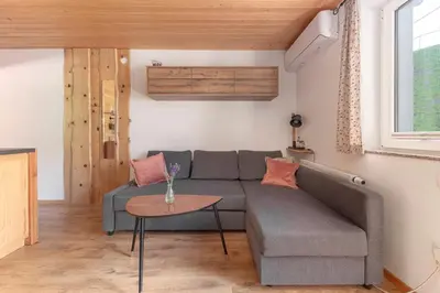 a living room with a couch and a table at Turistična kmetija Marovt in Bled