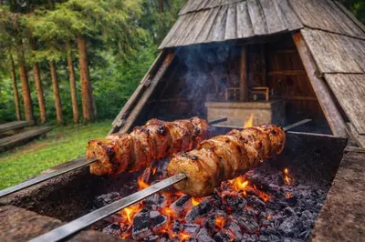 a group of food being cooked on a grill at Črjanski Raj in Črna na Koroškem