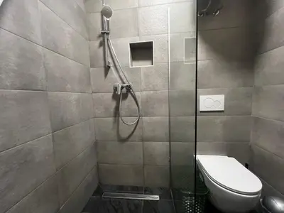 a bathroom with a shower and a toilet at Ljubljana studios in Ljubljana