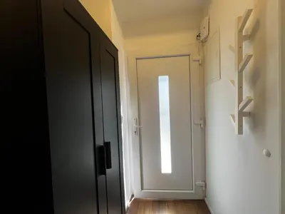 a hallway with a door and a window at Ljubljana studios in Ljubljana