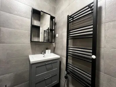 a bathroom with a sink and a mirror at Ljubljana studios in Ljubljana