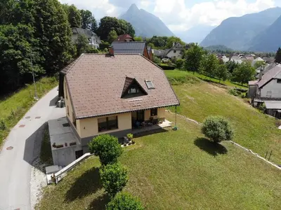 an aerial view of a house on a hill at Apartma Melinc in Bovec