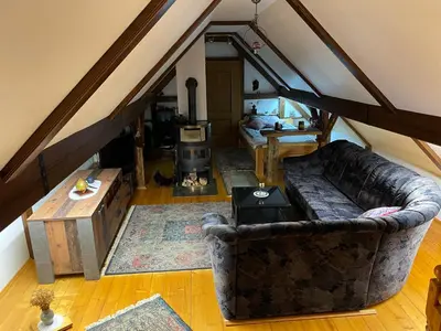 an overhead view of a living room with a couch at Hiša pod Rogatcem in Luče
