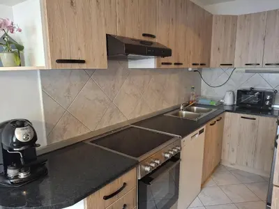 a kitchen with a sink and a counter top at Apartment Veninsek in Luče