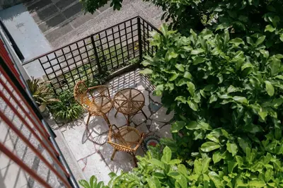 an overhead view of two tables and chairs in a garden at Ljubljana C17 4-Bedroom Private Row House with Garden and Parking in Ljubljana