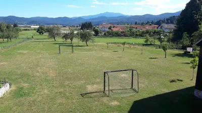 an open field with two soccer goals in it at Apartma Sterle in Stari Trg pri Ložu