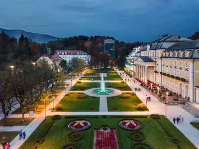 a city with a fountain in the middle of a park at VILLA GOLF Crystal Drop Apartment in Rogaška Slatina