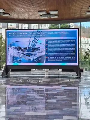 a large screen on a display in a building at VILLA GOLF Crystal Drop Apartment in Rogaška Slatina