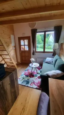 a living room with a couch and a table at Grajski oddih in Cerklje na Gorenjskem