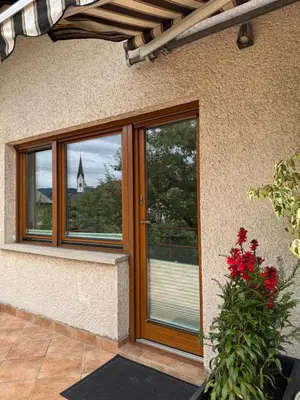 a front door of a house with a window at ANMARI Apartment & Rooms in Radovljica