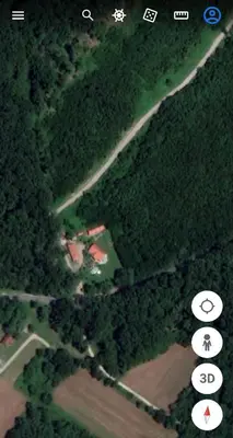 an aerial view of a house in the middle of a forest at Holiday Home - Goričko Park in Kobilje