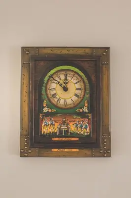a clock in a wooden frame on a wall at Apartment Amak with free onsite parking in Bovec