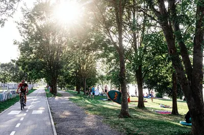 a person riding a bike down a path in a park at Camp Velenje in Velenje