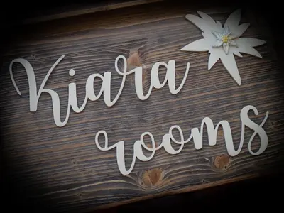 a sign that says vitamin words on a wooden table at Kiara Apartments & Rooms in Jesenice