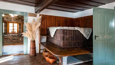 a room with a bird cage in a house at Domačija Gačnik in Idrija