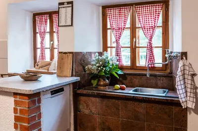 a kitchen with a sink and a window at Domačija Gačnik in Idrija