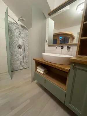 a bathroom with a sink and a shower at RITUAL in Ajdovščina