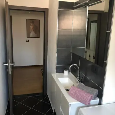 a bathroom with a sink and a mirror at Room Aria in Kobarid