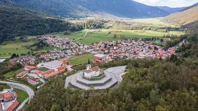 an aerial view of a town in the mountains at Room Aria in Kobarid