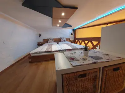 a room with a bed and a counter in it at Studio Srce in Kranjska Gora