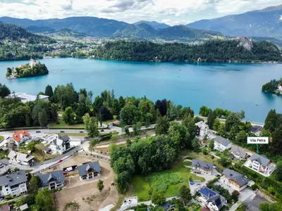 an aerial view of a town with a lake at Vila Petra - Family apartment for 4 at Lake Bled in Bled