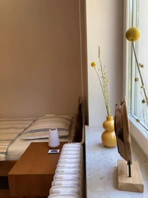 a living room with a bed and a table and a couch at Vila Mir - Apartment in Begunje na Gorenjskem