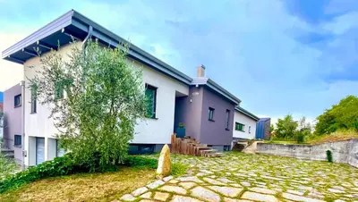 a house with a purple and white at MEGA in Prvačina