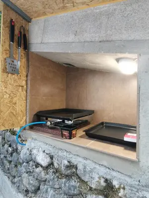 a kitchen with a stove top on a counter at Glamping Narnia in Bovec