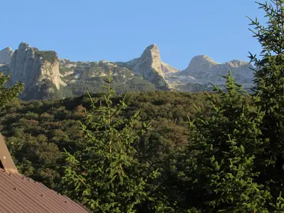 a view of the mountains from a house at Glamping Narnia in Bovec