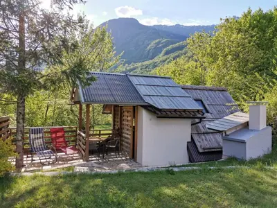 a small house with solar panels on the roof at Glamping Narnia in Bovec