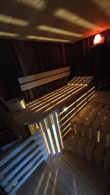 a row of wooden benches in a room at Chalets Toplak in Sveti Duh na Ostrem Vrhu