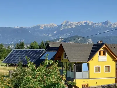 a house with solar panels on the roof at SPA Tubej - Adults Only in Bohinj