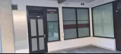a building with a door and windows on it at Apartman Alja, Kranjska Gora in Kranjska Gora