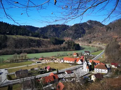 a small town with a river and a village at Apartmaji pri Dravi in Podvelka