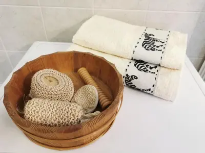 a wooden bowl filled with towels on a counter at Apartmaji ARKO in Ribnica